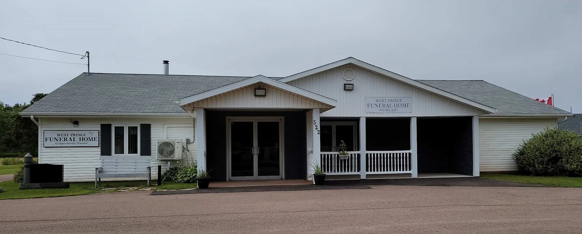 West Prince Funeral Home, a single-storey white building with a covered entrance on Thompson Road in Palmer Road, PEI